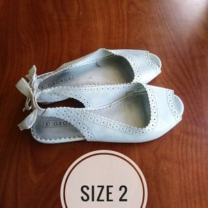 Girls size 2 shoes (four pairs included)